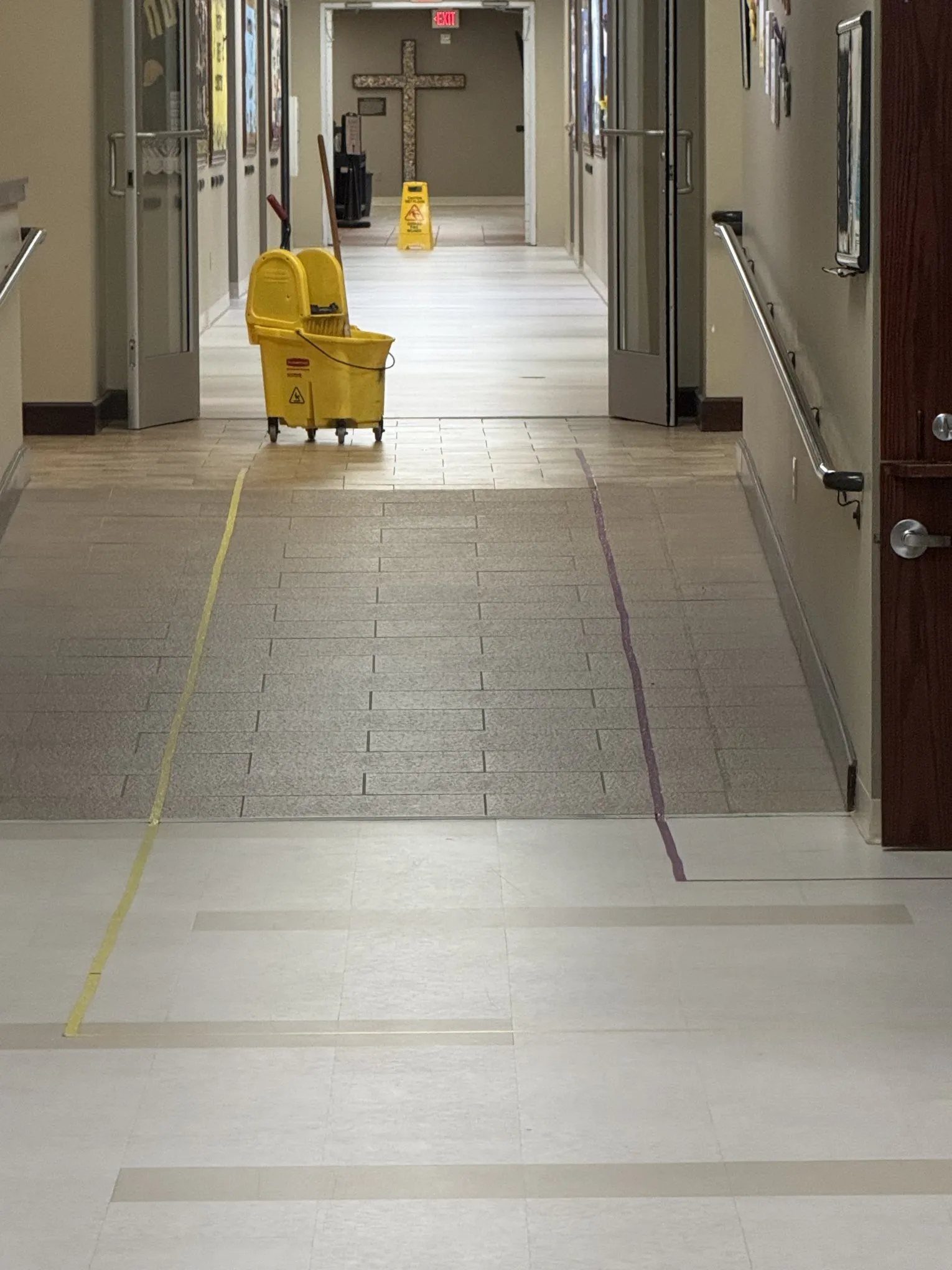Frisco Brothers crew member mopping a corridor at Grace Methodist Church