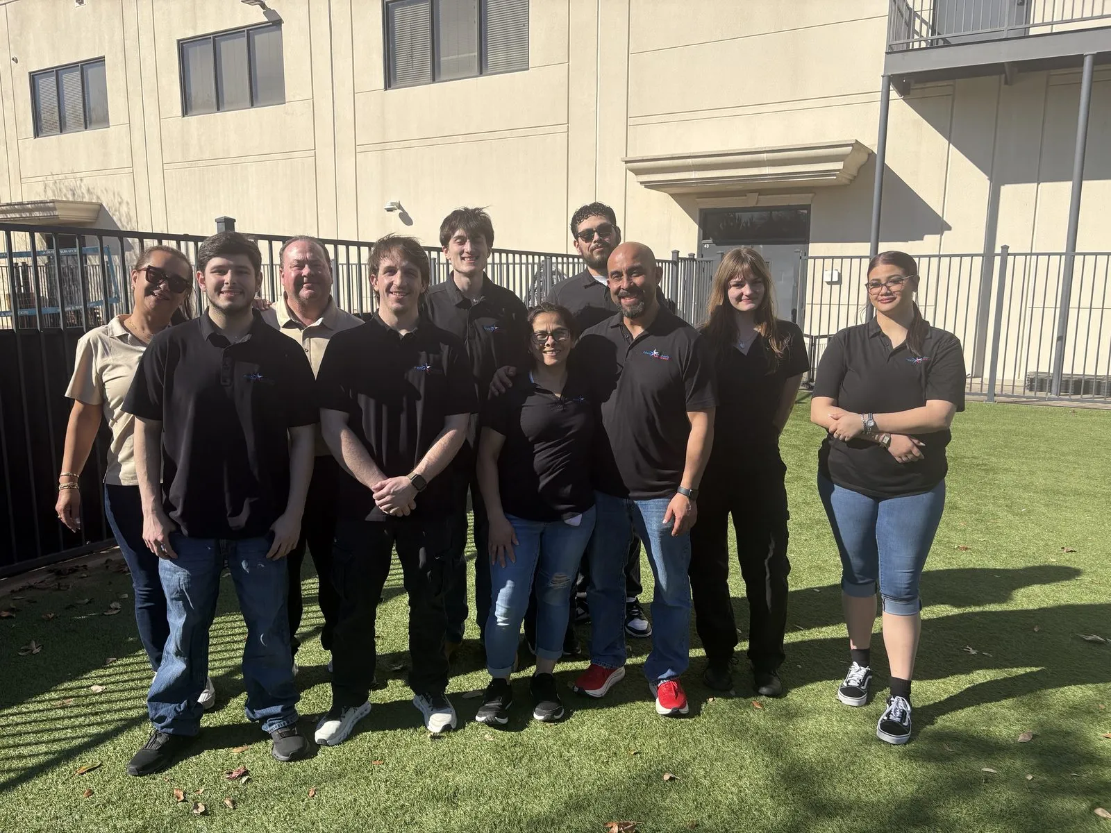 Mark, Sandra, and the Frisco Brothers crew on a job site