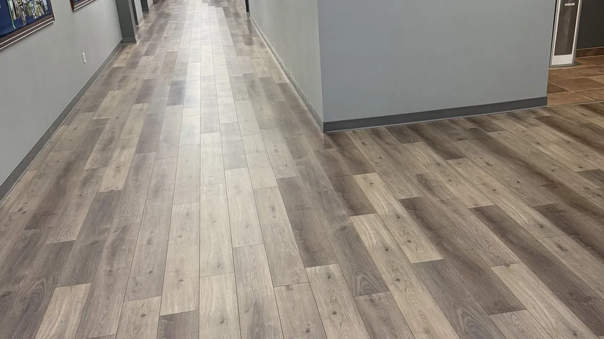 Clean hallway with wood-plank accent wall at Grace Methodist Church, maintained by Frisco Brothers